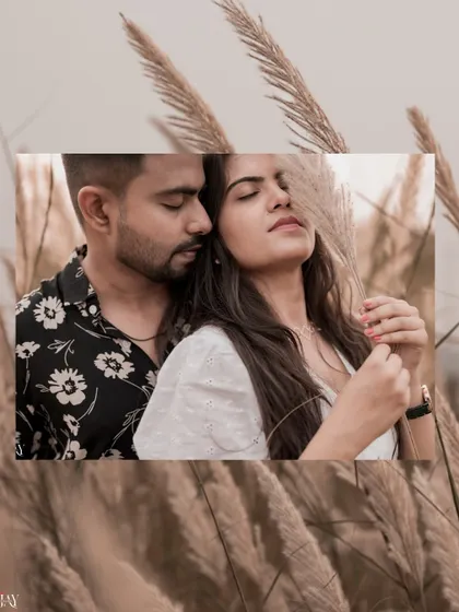 A creative, layered portrait of the couple in a pampas grass field, focusing on their intimacy.