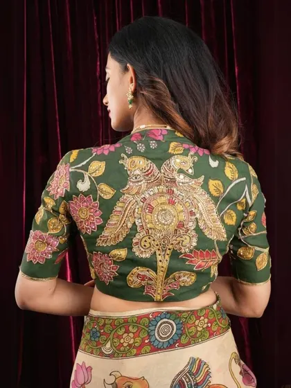 A different angle of the stunning peacock-motif Kalamkari blouse. You can see the fine lines and details that define this traditional art form. I ensure every piece is authentic and of the highest quality.