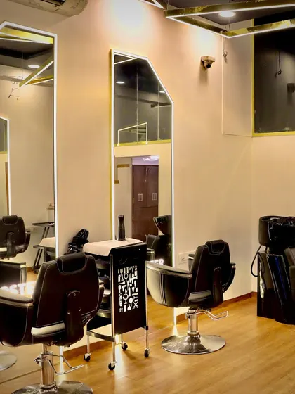 A closer look at my styling and treatment area. Each station is equipped with large, well-lit mirrors and comfortable seating, ensuring a premium experience whether you're here for a facial or a haircut.