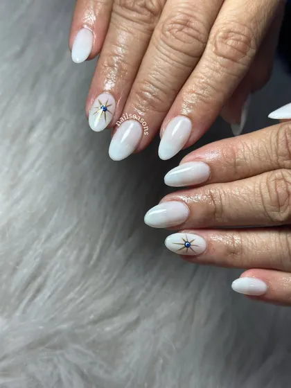 The gold and blue details of the evil eye design stand out beautifully against the soft white base.