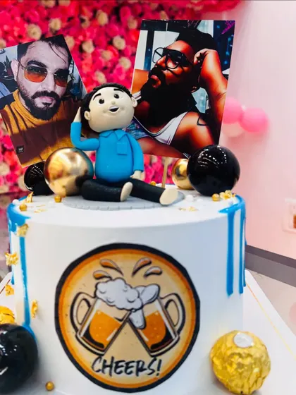 Another angle of the personalized "Habibi" cake, showing how photos and custom toppers can be combined for a unique design.