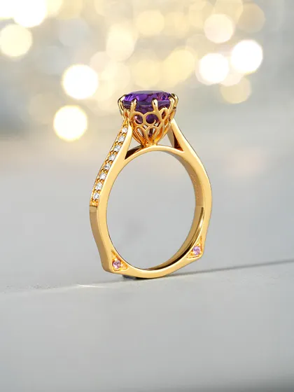 A closer look at the Amethyst Ring's craftsmanship. The gallery beneath the stone features intricate scrollwork, and a surprise pink sapphire is set on each side of the band. I believe true luxury is in these hidden details.