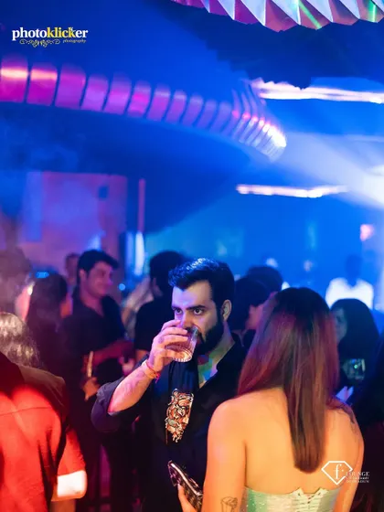A candid shot of a guest enjoying the party at F Lounge, capturing the authentic vibe of a club night.