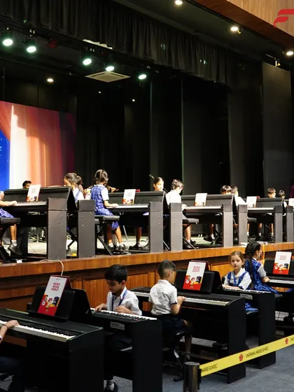 A wide view of the keyboard section at the CSN School Annual Recital in Pune. Our music labs enable large groups of students to learn and perform together, creating a powerful collective sound.