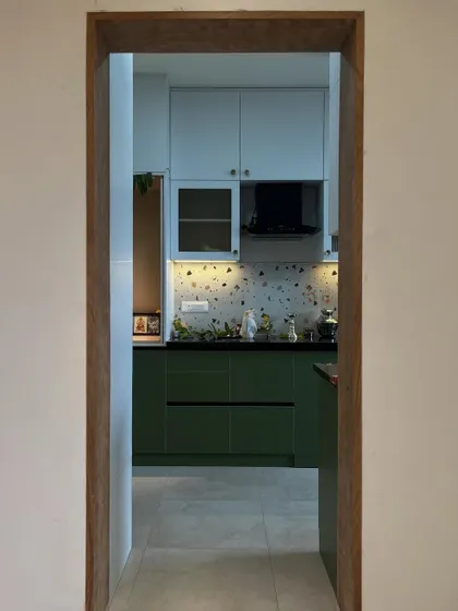 Green, clean, and a little too aesthetic to ever get messy. (We can pretend.) A peek into a stunning two-tone kitchen with terrazzo-style backsplash.