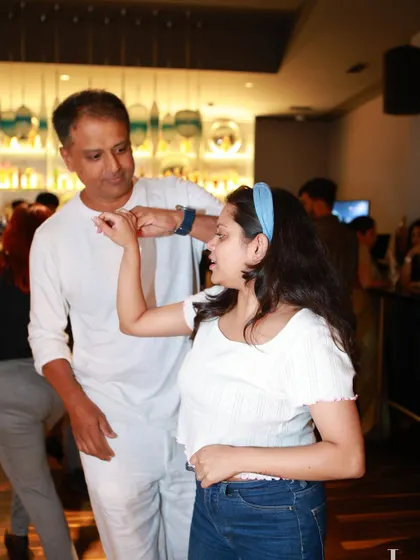 A close-up of a dance connection, showing the handhold and the focus between partners. It’s all in the details.