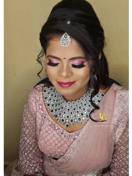 A soft yet glamorous reception style. You'll learn how to create this beautiful pink smokey eye and pair it with a heavy diamond and emerald necklace for a modern, elegant finish.