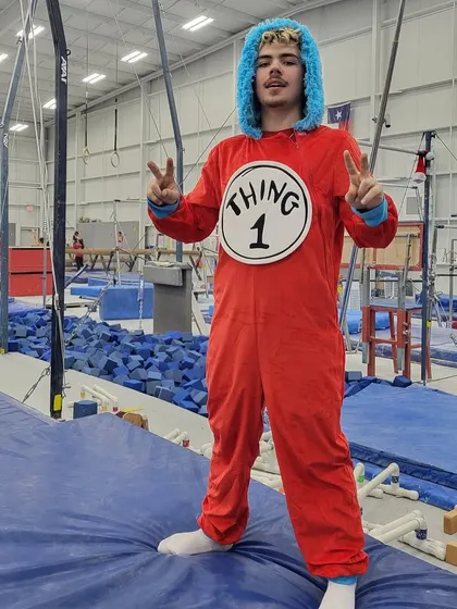 A coach fully embracing the Dr. Seuss theme as Thing 1. This is the kind of playful energy you can expect from our team during our fun themed weeks.
