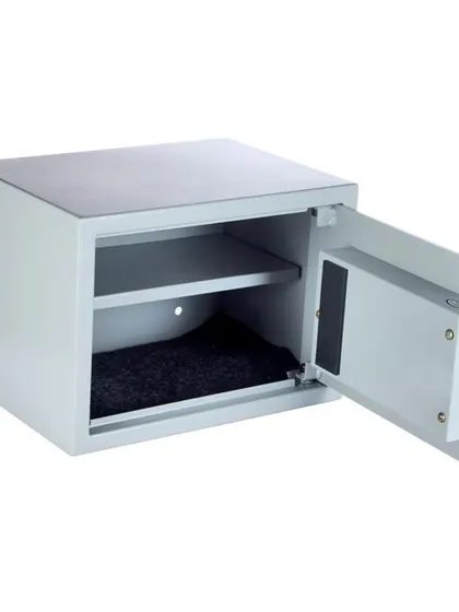 An open view of the Tusker-44 safe, showing its grey interior, removable shelf, and carpeted bottom.