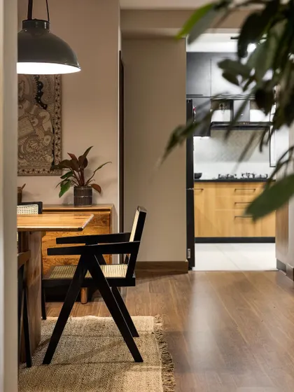 A view from the dining area towards the kitchen in 'Ikigai Living'. The open sightlines create a sense of flow and connection between the different functional areas of the home.