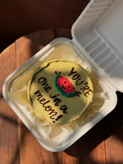 A sweet and punny cake that says "You're one in a melon!" with an adorable drawing of a smiling watermelon. It's a cute way to show someone you care.
