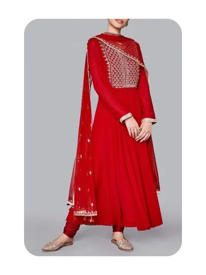 This full-sleeve red Anarkali features a heavily embroidered yoke, creating a rich and festive appearance. I ensure the embroidery placement is flattering and the sleeves are tailored for comfortable movement.