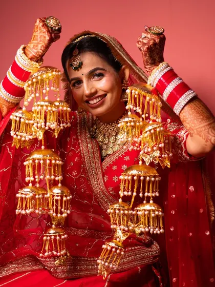 A joyful bride showing off her beautiful kalire. We capture the excitement and happiness of these traditional moments.
