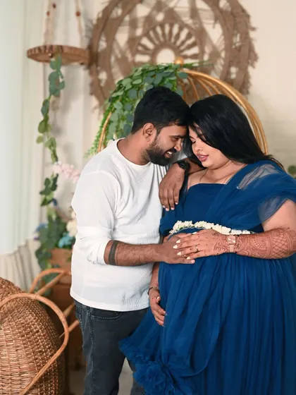 A tender moment between the couple. The way he looks at her while she cradles her bump is what makes these photos so precious.