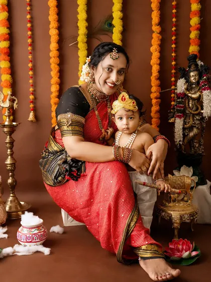 A mother and her baby Krishna in a beautiful traditional setting, perfect for celebrating Janmashtami.