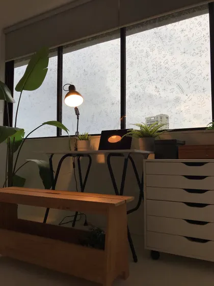 My studio at dusk. The warm glow from the lamp creates a cozy atmosphere for evening drawing sessions.