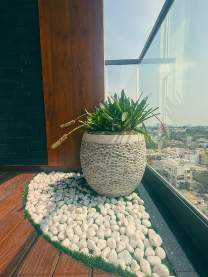 Another view of the client's setup, where the pebble planter is the centerpiece of a beautiful balcony garden.
