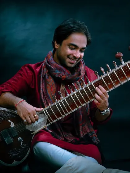 A portrait capturing the joy I feel when I hold my sitar. It is more than an instrument to me; it's a part of my soul.