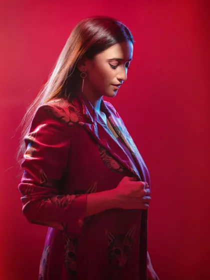 A change in posture and gaze can completely alter the story. Here, the downward glance and side lighting create an introspective and elegant portrait, showcasing a different emotional range for the actor.