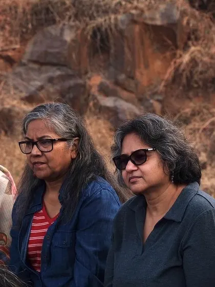 Close-up of audience members completely absorbed in the meditative musical performance at Aravali Nagar Van.