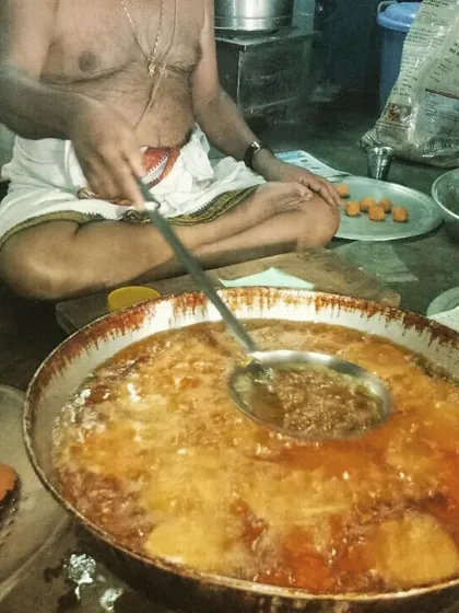Frying sweets to perfection. This is where the magic happens, turning simple ingredients into mouth-watering traditional Indian desserts.