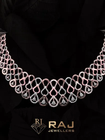 An exquisite example of modern design, this two-tone necklace features an intricate web of interlocking teardrop shapes, meticulously set with brilliant CZ stones. The design creates a sense of fluid movement and sophisticated glamour, perfect for evening wear.
