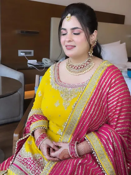 A close-up of Kajol's Shagan makeup. The soft pink eyeshadow and flawless skin create a look that is pretty and festive.