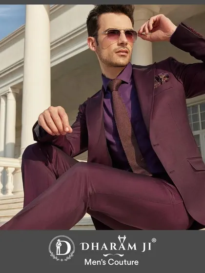 A model in a monochromatic purple suit, shirt, and tie combination. This is a bold, fashion-forward look that shows how to use color to create a memorable outfit.
