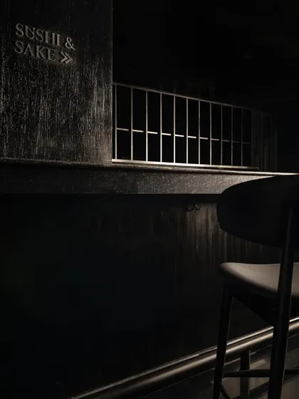 A collection of atmospheric shots from Lair, showcasing the interplay of black concrete, glass blocks, polished steel, and dramatic lighting. Each image captures a fragment of the bar's mysterious and immersive character.