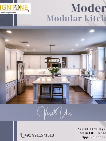An elegant all-white modular kitchen with a central island and shaker-style cabinets. The sophisticated lighting and clean design create a timeless and luxurious feel, perfect for any modern home.