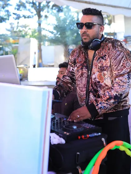 Performing at an outdoor daytime wedding event. My setup is versatile, allowing me to play anywhere, from a sunny lawn to a dark nightclub.