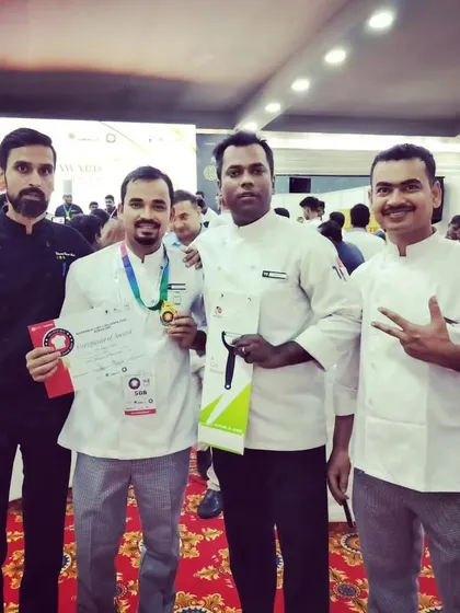 Chef Nurul with his mentors and fellow chefs, celebrating his well-deserved gold medal achievement.