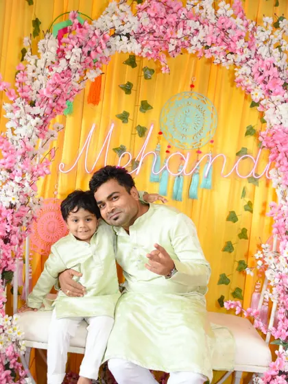 A fun, posed shot of the father and son, capturing their cool style and close bond.