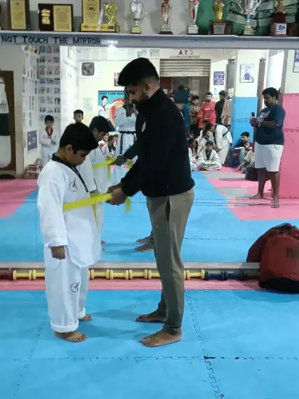 Tying a new yellow belt.