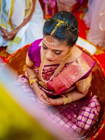 A duplicate of image 34, showing a South Indian bride during a traditional ritual.