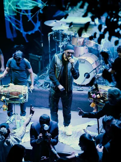 We also cover celebrity performances that make your Sangeet unforgettable. This shot captures the energy of singer Sukhbir on stage, with the crowd dancing and enjoying the live concert experience.