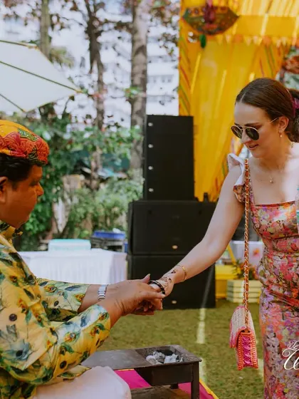 A guest getting a traditional 'nazar' ritual done for good luck.