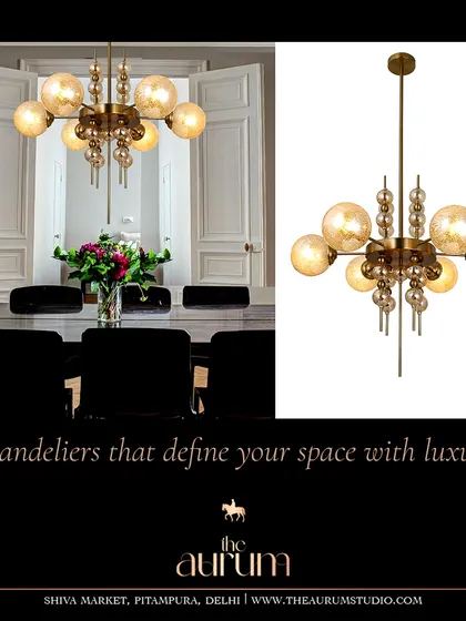 A beautiful example of a transitional chandelier, blending classic globe shapes with a modern structure. It’s versatile enough to complement both a formal dining room and a more relaxed living space.