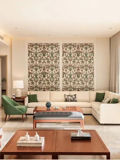 Welcome to our world of design, where every space is crafted to be a sanctuary. This living area from our Max128 project in Noida opens onto a lush deck, embodying our philosophy of blurring the lines between inside and out. We believe a home should be a place to slow down and reconnect, using clean lines, natural light, and a blend of contemporary and Indian design elements to create a feeling of calm.