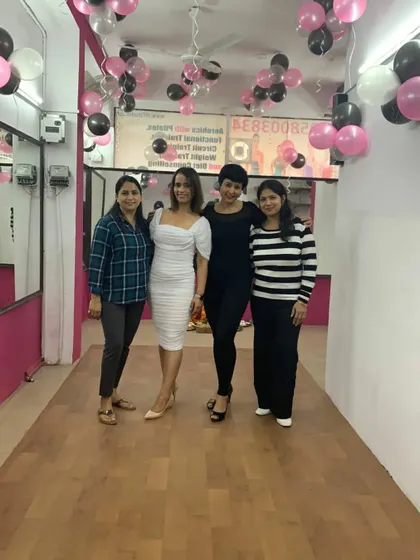 A group photo with the amazing women who came to support our new studio. The energy was incredible.