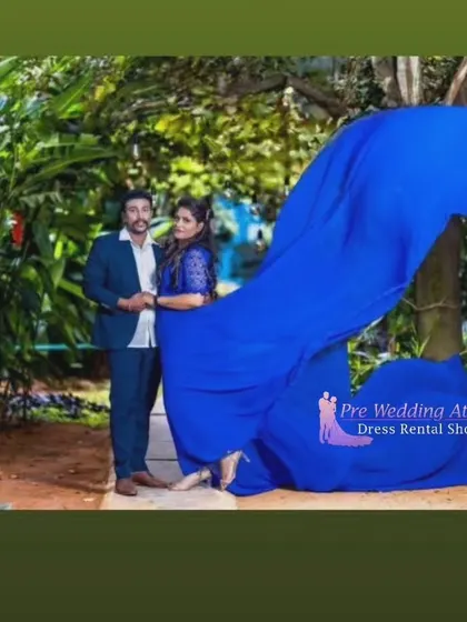 This shot captures the impressive volume of the royal blue flying gown as it swirls around the couple, creating a dynamic and colorful image.