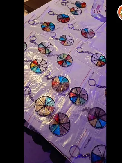 A collection of finished keychains, each one unique. This is a great return gift idea that kids make themselves during the party.
