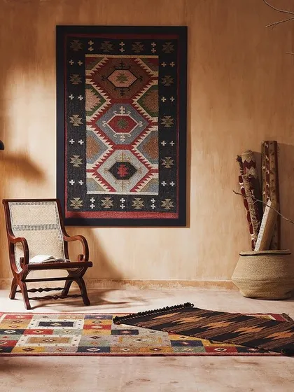 A gallery-like setting displaying multiple rugs as works of art. This shot presents floor coverings in a creative and elevated context, highlighting their intricate patterns and colors.