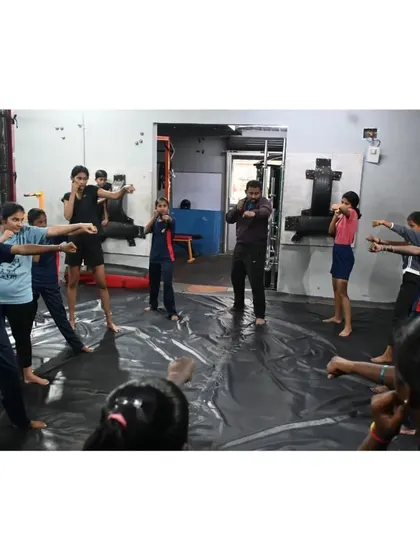 Our coach demonstrating the basic fighting stance to the group. Proper fundamentals are the key to effective self-defence, and we make sure everyone starts with a strong base.