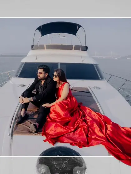 A stylish shot of the couple relaxing on the bow of a yacht. This image exudes luxury, romance, and the carefree spirit of a destination pre-wedding shoot.