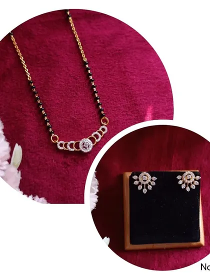 A beautiful mangalsutra and earring set, this design features a delicate pendant and matching floral studs. It's a perfect combination of tradition and modern style.