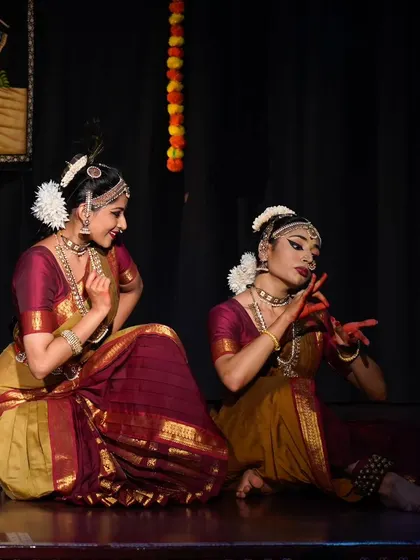 Another moment of playful coaxing from the 'Rusali Radha' performance. The chemistry between the two dancers is essential to make the story feel alive.