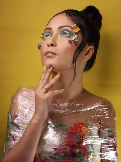 For this creative editorial, I used tiny floral appliqués and a dewy, ethereal base to craft a look that feels like a wearable piece of art. This style is perfect for fashion stories with a whimsical or romantic theme.