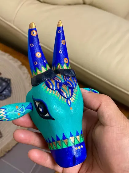 This Nandi in shades of teal and royal blue is accented with gold highlights, giving it a touch of regal elegance.