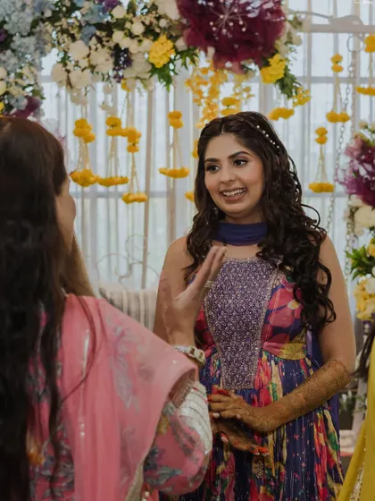 Chatting with guests and enjoying her party. The makeup is designed to be comfortable for long hours.